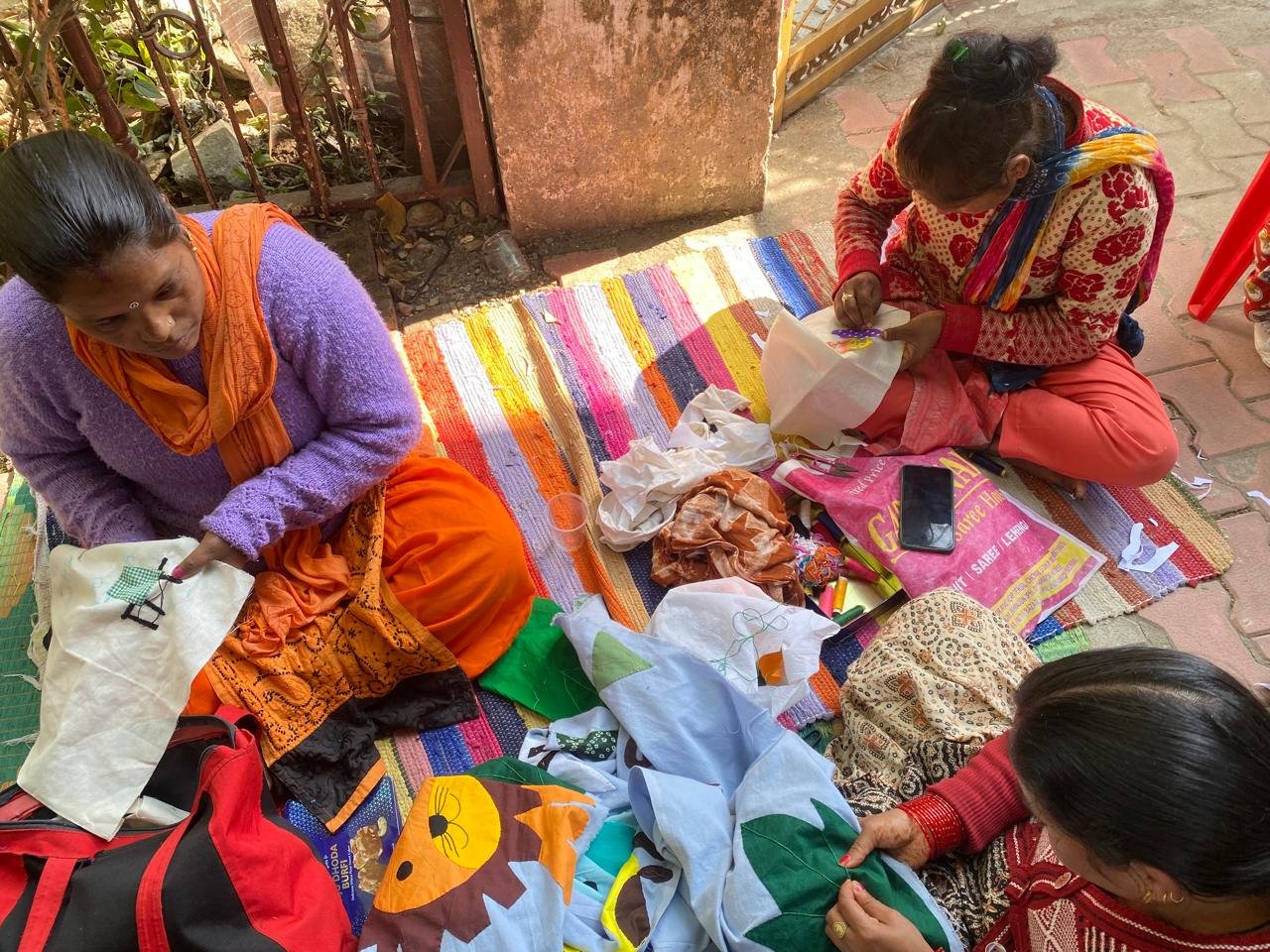 Women artisans working on handcrafted products